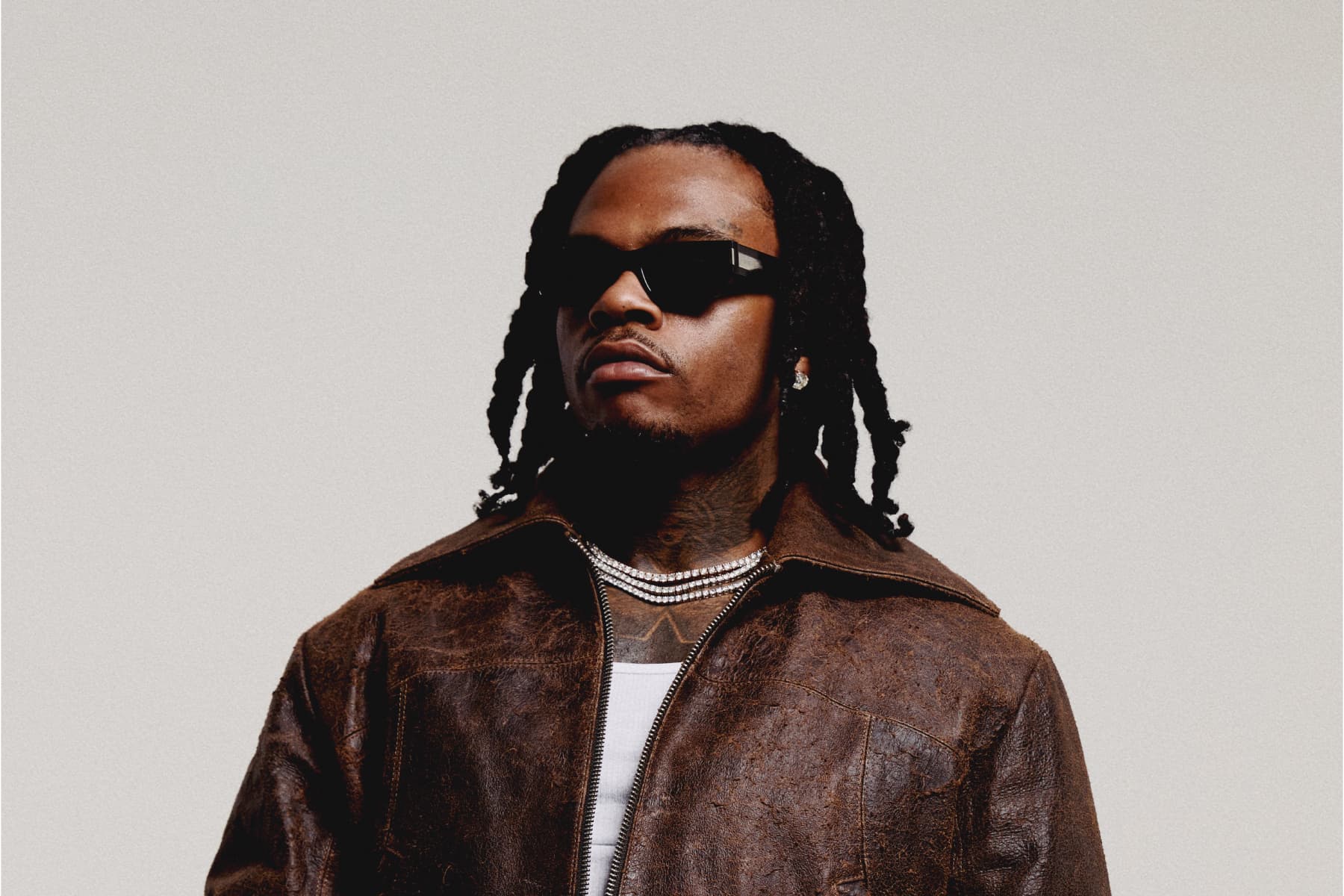 Gunna wearing a leather jacket